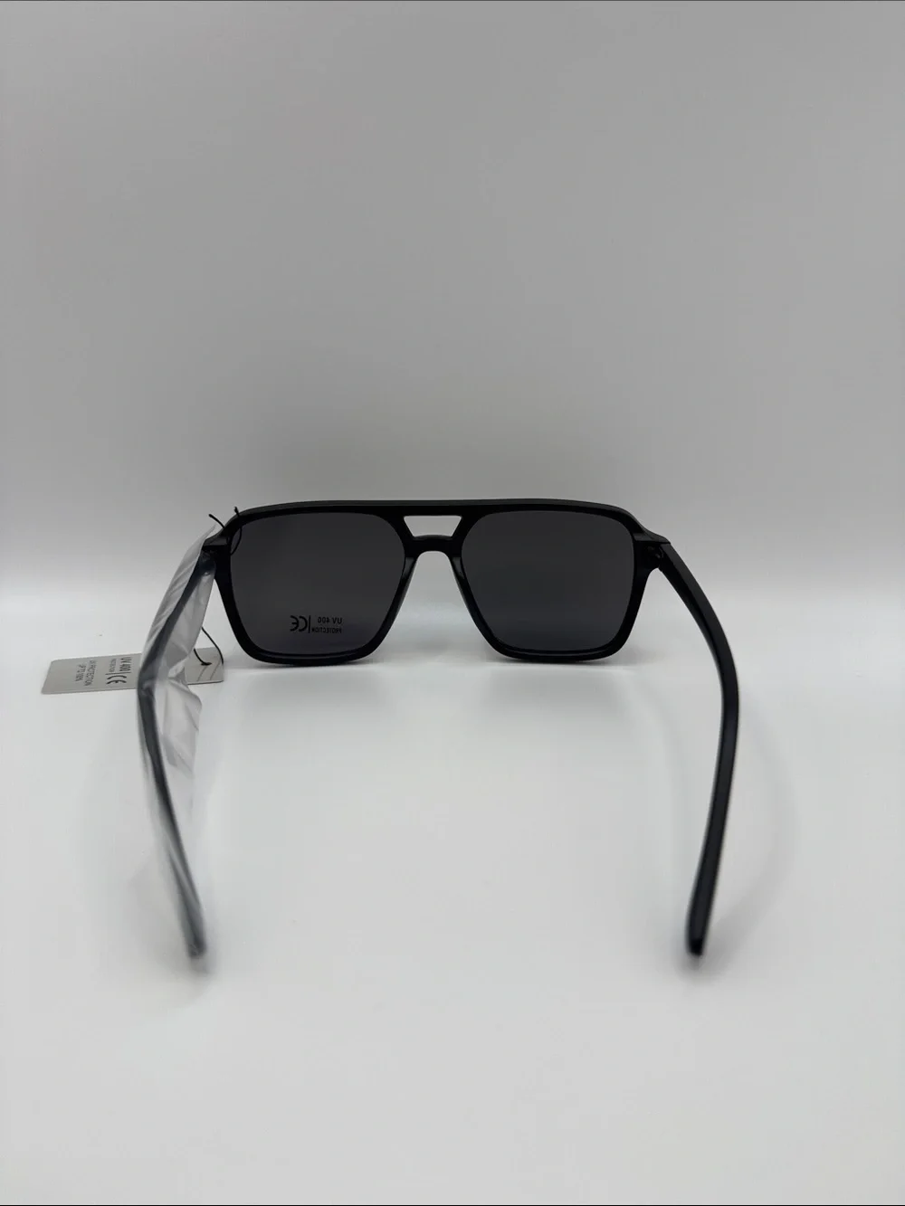 Black Sunglasses with Dark Lenses and Gold Accents